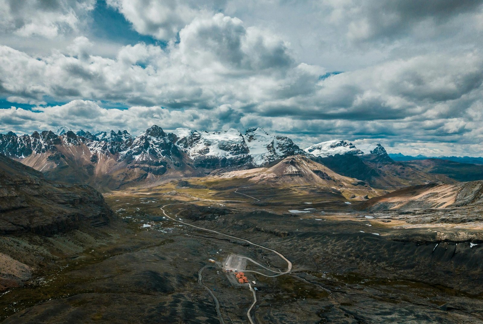 Stunning aerial view of snow-capped Andes mountains, showcasing Peru's majestic landscape.